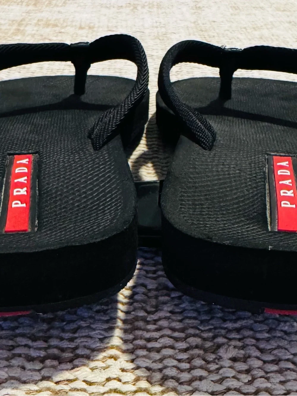 Prada Black Flip-Flop Sandals with Red Logo Accents